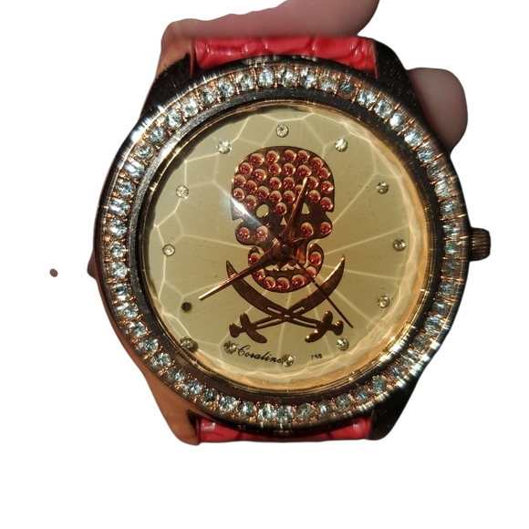 Coraline Accessories - Skull & Cross Swords Watch featuring a Crystal-Studded Bezel and Red Band.